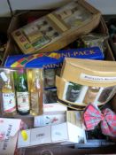 A collection of alcohol miniatures in presentation packs and boxes, including Glenmorangie whisky,