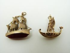 Two 9ct gold pendants/ charms in the form of boats,