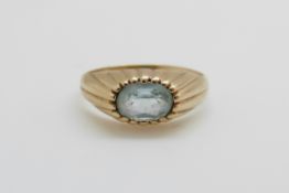 A 9ct gold ring set with an oval pale blue topaz (size I)