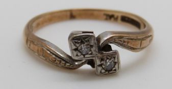A 9ct gold ring set with two diamonds in a platinum setting, 2.