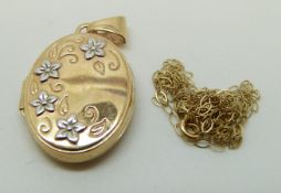 A 9ct gold locket with floral decoration and chain, 2.5 x 1.7cm, 1.