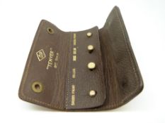 A set of 9ct gold studs in fold-up leather wallet (3.