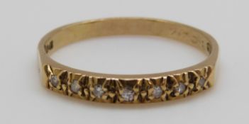 An 18ct gold ring set with diamonds (size O)