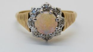 An 18ct gold ring set with an opal,