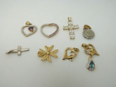 A collection of mainly 9ct gold pendants including diamond set, filigree, hearts, crosses etc., 12.