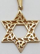 A 14k gold pendant and 9ct gold chain