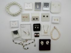 A collection of pearls, including a silver necklace set with pearls, pearl bracelet,