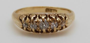 An 18ct gold ring set with five diamonds, 3.