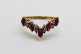A 14ct gold ring set with diamonds and rubies in a V shape, 3.