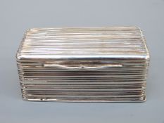 A Georgian hallmarked silver nutmeg grater of rectangular ribbed form,