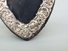 A hallmarked silver heart shaped photograph frame with ease; back,