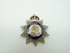 A British Army Honourable Artillery Company gold and platinum brooch set with diamonds and with red