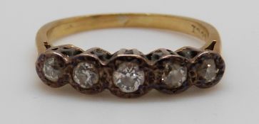 An 18ct white gold ring set with five diamonds,