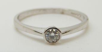 An 18ct white gold ring set with a diamond of approximately 0.2ct, 2.