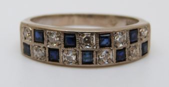 An 18ct white gold ring set with square sapphires and alternating diamonds (size M)