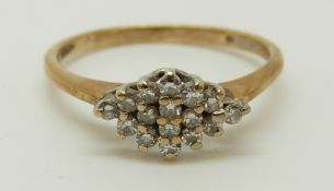 A 9ct gold ring set with diamonds in a cluster, 1.