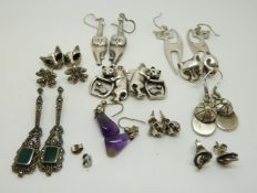 Six pairs of silver cat earrings,