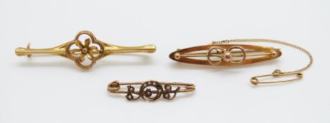 Two 9ct gold Edwardian brooches and a yellow metal brooch set with seed pearls,