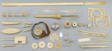 A collection of 19thC ivory and bone items including a Chinese carved ivory bobbin or sewing clamp,