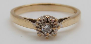 A 9ct gold ring set with a diamond in a platinum setting (size L)
