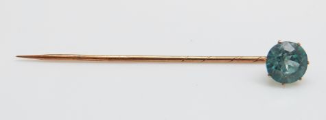 A Victorian stick pin set with a zircon, 5.5cm long,(zircon 0.8cm),1.