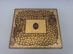 A 19thC Chinese lacquer games box with lift off lid revealing five further lidded boxes containing