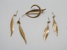 A 9ct gold leaf brooch and two pairs of 9ct gold earrings, 3.