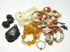 A Victorian jet brooch in the form of a hand and a rose, a Victorian jet pendant,