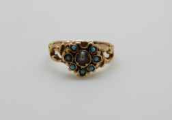 A Victorian ring set with a seed pearl surrounded by turquoise, 1.