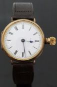 9ct gold gentleman's wristwatch converted from a pocket watch with Roman numerals,