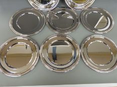 A set of eight silver plated platters, diameter 28cm,