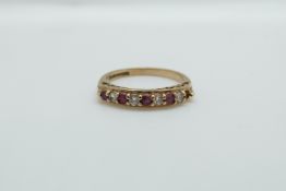 A 9ct gold ring set with alternating cubic zirconia and rubies, 2.
