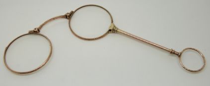 A pair of lorgnettes with chased detail,