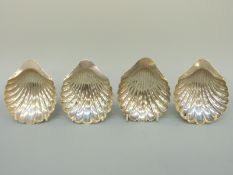 Four Victorian and later hallmarked silver shell dishes, raised on three ball feet, Sheffield 1893,