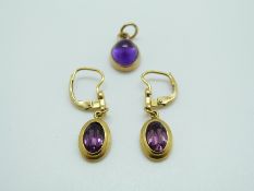 A 9ct gold pendant and earrings set with amethyst