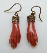 A pair of Victorian earrings in the form of hands