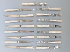 A set of eight hallmarked silver cake knives and forks with mother of pearl handles (eight knives