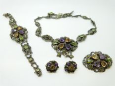A suite of silver Arts & Crafts suffragette jewellery by Zoltan White & Company set with purple,