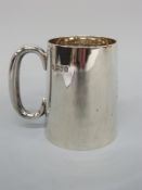 An Edward VII hallmarked silver tankard of plain tapering form,
