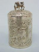 An Indian or similar white metal pot with embossed decoration,