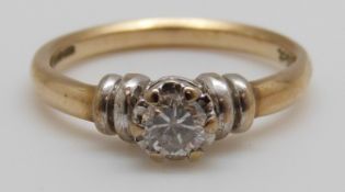 A 9ct gold ring set with a round cut diamond of approximately 0.