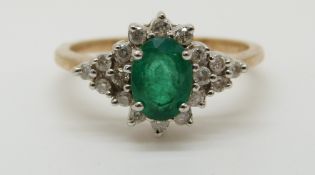 A 9ct gold ring set with an oval cut emerald of approximately 0.