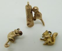 Three 9ct gold charms including woodpecker, squirrel and monkey, 7.