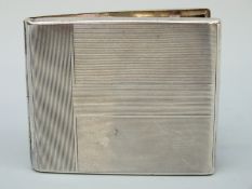 An Art Deco white metal cigarette case marked 925,