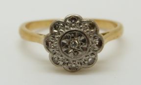An 18ct gold ring set with diamonds in a platinum setting, 2.