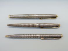 A Parker Sonnet three piece white metal pen / pencil set comprising pen with 585 gold nib,
