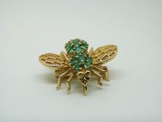 A 14ct gold brooch/ pendant in the form of an insect set with emeralds, 2.