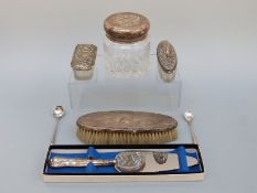 A quantity of hallmarked silver mounted items including dressing table bottles, cake slice etc.