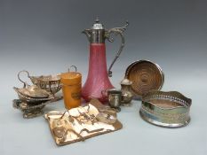 A collection of plated ware to include a pair of wine coasters, Mauchline ware glass holder,