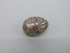 A late 18th/early 19thC white metal pomander or spice holder of ovoid form with two part screw